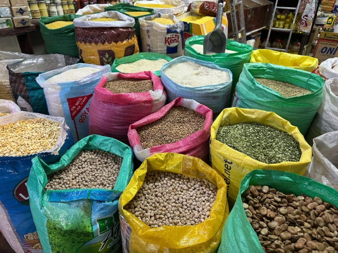 Colorful bags of grains and legumes at a market